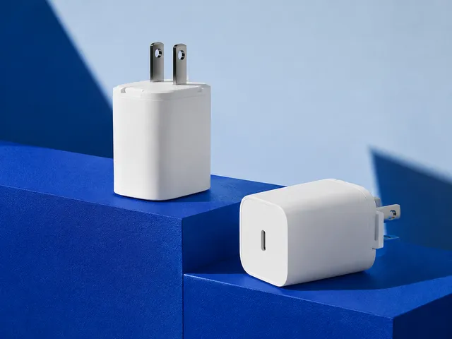 AI-generated illustration of compact white chargers on blue geometric display blocks.
