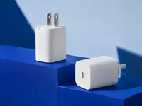 AI-generated illustration of compact white chargers on blue geometric display blocks.